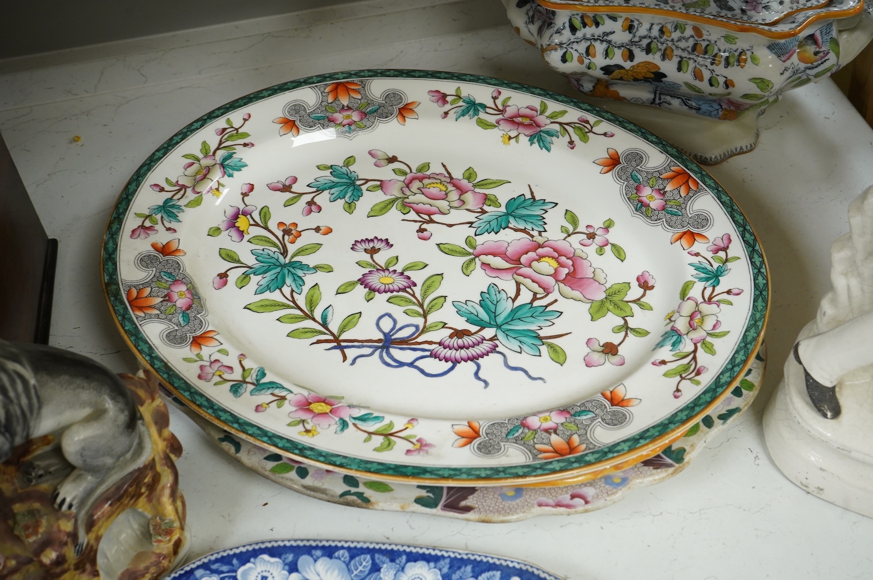 Three 19th century Staffordshire figures, including General Garibaldi, a Staffordshire pottery soup tureen and four serving plates, largest 48cm wide